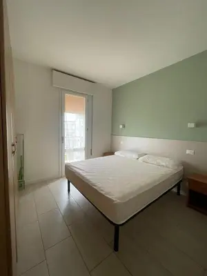 Letto o letti in una camera di Condominio MICHELANGELO-Solo per famiglie- WALTERIGATO Apartments