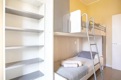 Letto o letti in una camera di Jesolo Vista Lido - Family Deluxe Apartment