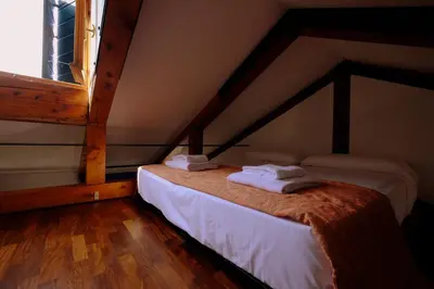 Letto o letti in una camera di Mansardina San Marco
