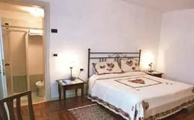 Letto o letti in una camera di Casa del Miele