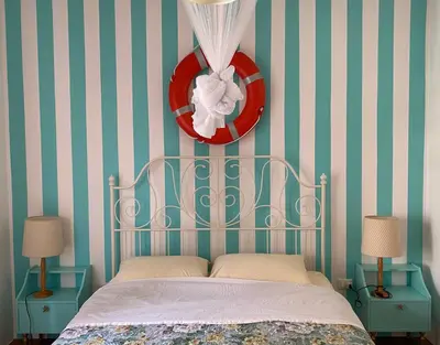 Letto o letti in una camera di Jesolo Pineta - Appartamento Due Camere Matrimoniali Fronte Mare