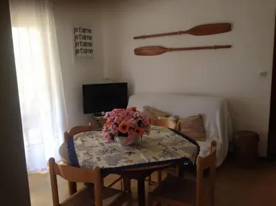 TV o dispositivi per l'intrattenimento presso Jesolo Pineta - Appartamento Due Camere Matrimoniali Fronte Mare