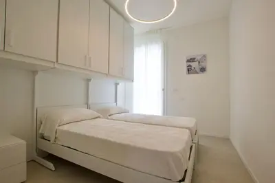 Letto o letti in una camera di H10 - Home Immobiliare Jesolo