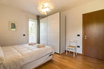 Letto o letti in una camera di enJoy Home - Appartamento ampio, luminoso e immerso nel verde