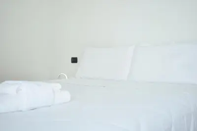 Letto o letti in una camera di Villafranca Relaxing apartment