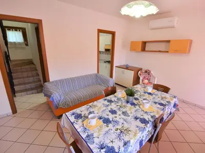 Area soggiorno di Apartment Solmare-14 by Interhome