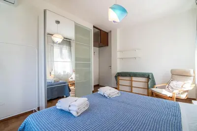 Letto o letti in una camera di enJoy Home - Bilocale sulle Riviere a due passi dalla Specola