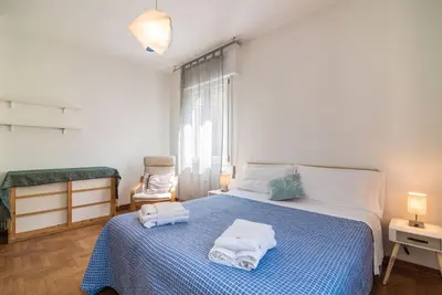 Letto o letti in una camera di enJoy Home - Bilocale sulle Riviere a due passi dalla Specola