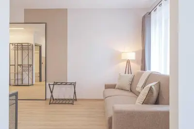 Area soggiorno di A 3 minuti dal centro storico In Style Apartment con parcheggio gratuito