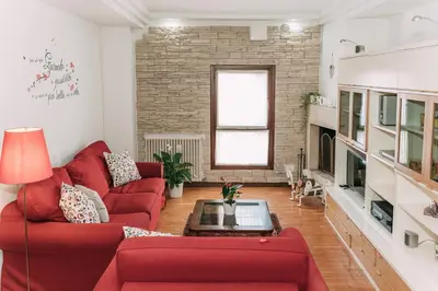 Area soggiorno di Palladio Apartment - In Centro con Garage, Vista Fiume, Jacuzzi
