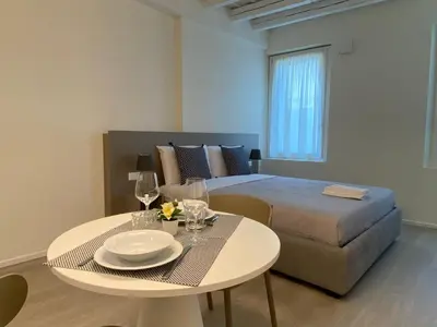 Letto o letti in una camera di Residenza SubitoSanto - Appartamento 1A Ruzzante