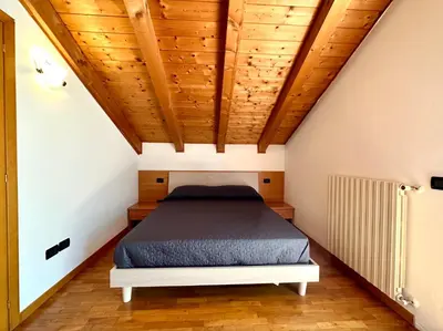 Letto o letti in una camera di Ginevra - Carraro Immobiliare - Family Apartments
