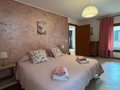 Letto o letti in una camera di Ali