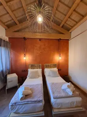Letto o letti in una camera di Corte Lusenzo