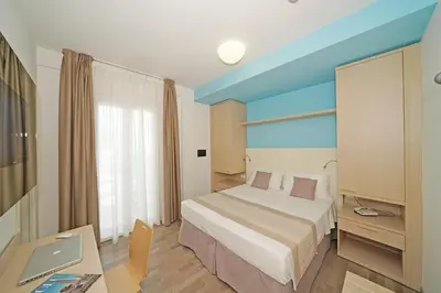 Letto o letti in una camera di Hotel Strand a frontemare