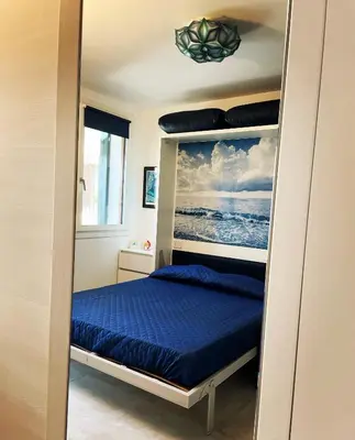 Letto o letti in una camera di Le Vele Luxury Mini Apartment