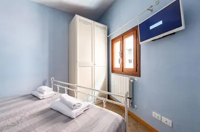 Letto o letti in una camera di GuestHost - Arsenale Duplex Apartment