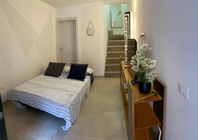 Letto o letti in una camera di CasaBella Chioggia casa indipendente con corte