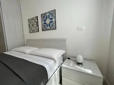 Letto o letti in una camera di Appartamento ai Portici di Via Savonarola