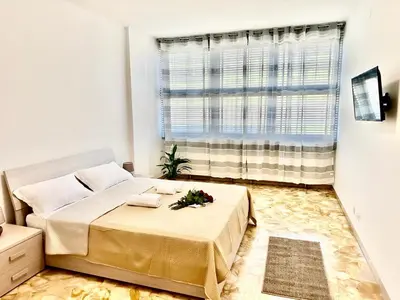 Letto o letti in una camera di Happy Stay