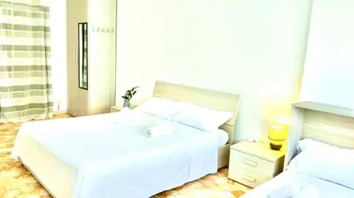 Letto o letti in una camera di Happy Stay