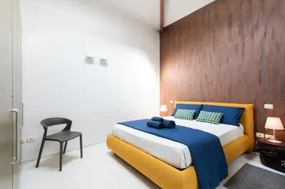 Letto o letti in una camera di Girolamo Loft by Welchome