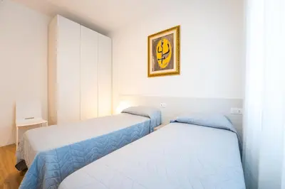 Letto o letti in una camera di Trilocale Piazza DRAGO - Adria Holiday Jesolo - FAMILY APARTMENT