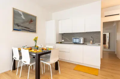 Cucina o angolo cottura di Trilocale Piazza DRAGO - Adria Holiday Jesolo - FAMILY APARTMENT