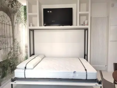 Letto o letti in una camera di AL PONTE design apartment