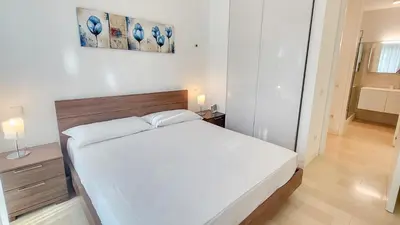 Letto o letti in una camera di Merville family apartment