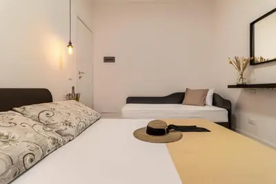 Letto o letti in una camera di GIGI HOUSE [appartamento PIAZZA MAZZINI] 300m dal mare