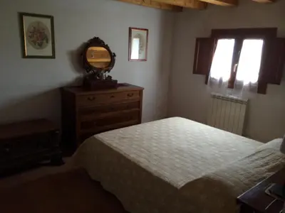 Letto o letti in una camera di Villa Pastori