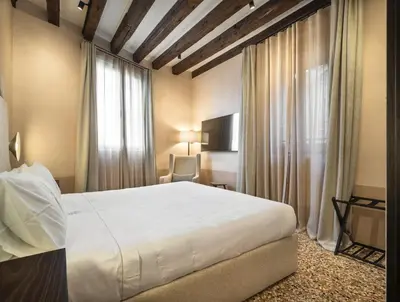 Letto o letti in una camera di Palazzo dell'albero d'Oro