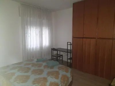 Letto o letti in una camera di Spazioso Appartamento in casa singola Padova con giardino