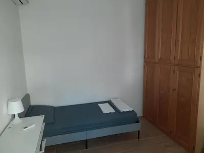 Letto o letti in una camera di Spazioso Appartamento in casa singola Padova con giardino