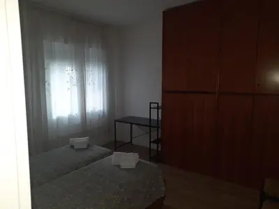 Letto o letti in una camera di Spazioso Appartamento in casa singola Padova con giardino
