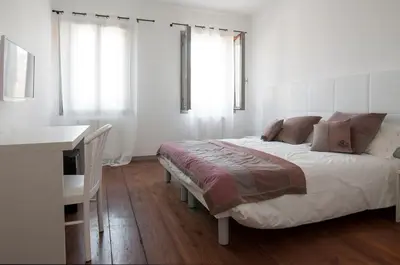 Letto o letti in una camera di Scrovegni Room & Breakfast