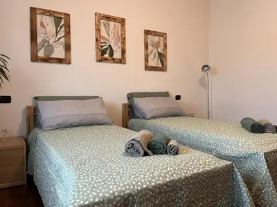 Letto o letti in una camera di Ornella's apartment - Relax near Venice
