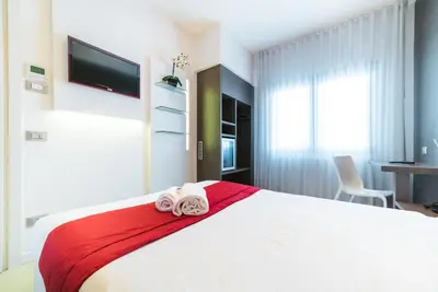 Letto o letti in una camera di Hotel Calaluna