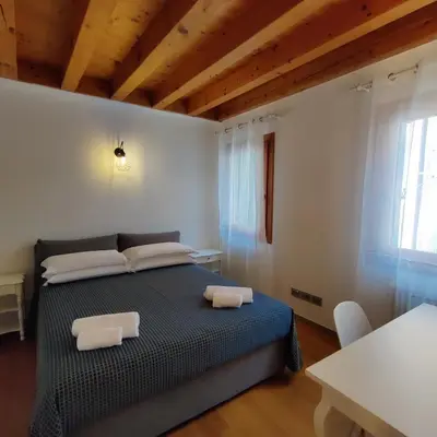 Letto o letti in una camera di Palazzo degli Artisti
