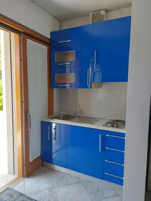 Cucina o angolo cottura di INDIGO APARTMENT Cavallino Treporti