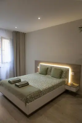 Letto o letti in una camera di RomanApartments