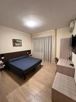 Letto o letti in una camera di Hotel Colonna