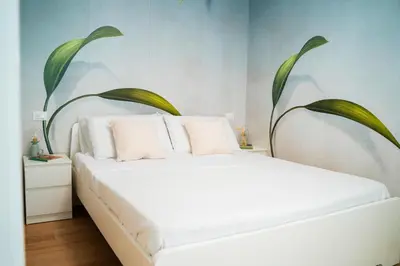 Letto o letti in una camera di La Bella Vita - Giardino al Mare