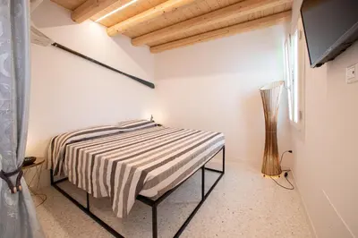 Letto o letti in una camera di Dimora Oreste - Isola di Pellestrina Ve