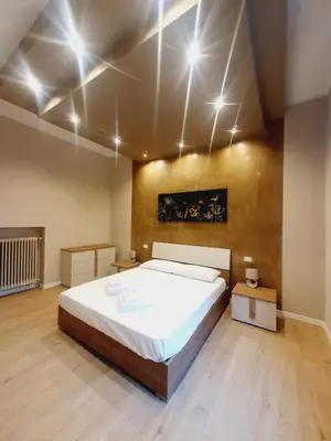 Letto o letti in una camera di Casa Tiffany