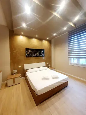 Letto o letti in una camera di Casa Tiffany
