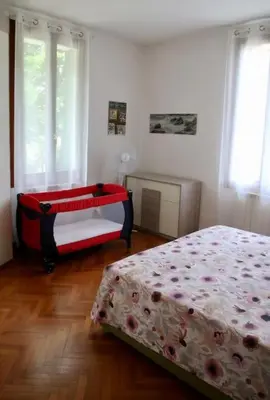 Letto o letti in una camera di Isola del Lido, Luminoso, immerso nel verde, per 5