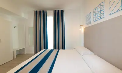 Letto o letti in una camera di Hotel Paolina
