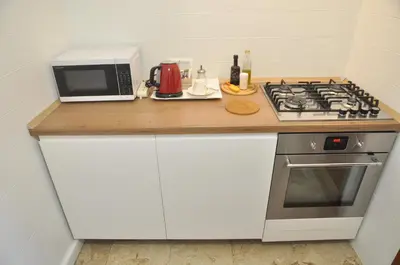 Cucina o angolo cottura di Corte Formenta Holiday Home - 5 minuti da Biennale